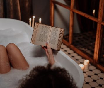 woman reading in bath